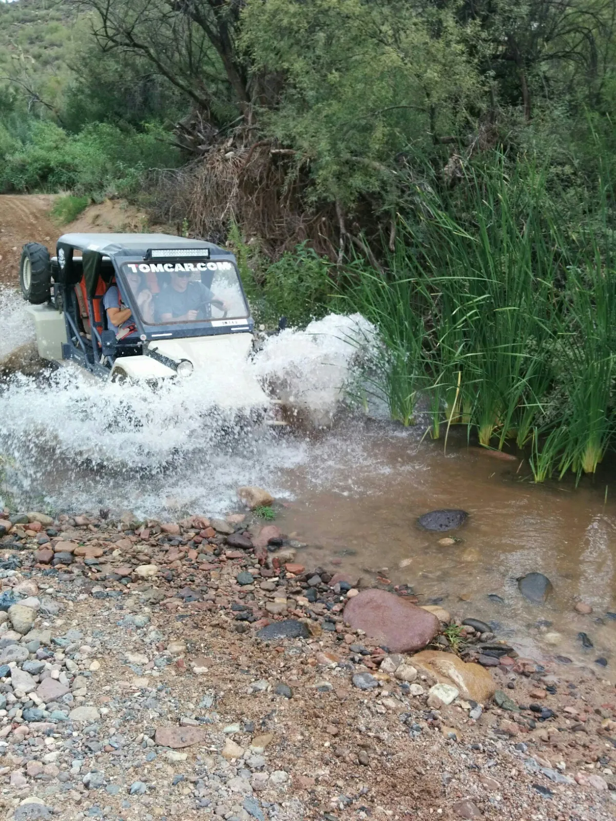 Tomcar ATV tour crossing river Scottsadle