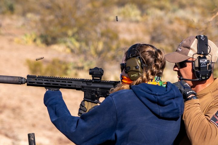 a person wearing a helmet and holding a gun