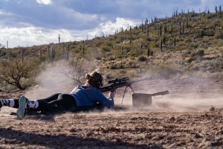 a man lying on a dirt road