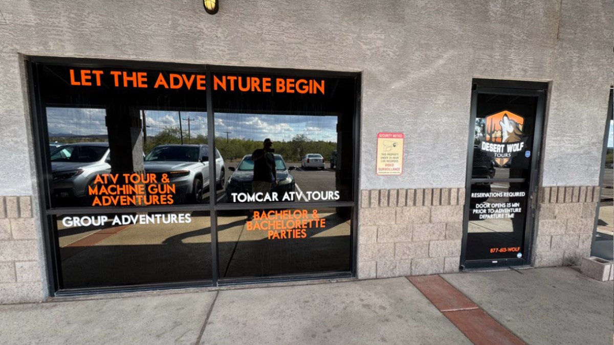 Exterior of Desert Wolf Tours with signage for Phoenix and Scottsdale ATV tours and adventures.