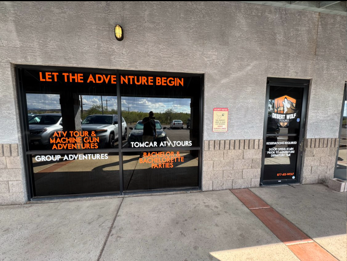 Exterior of Desert Wolf Tours with signage for ATV tours and adventures.
