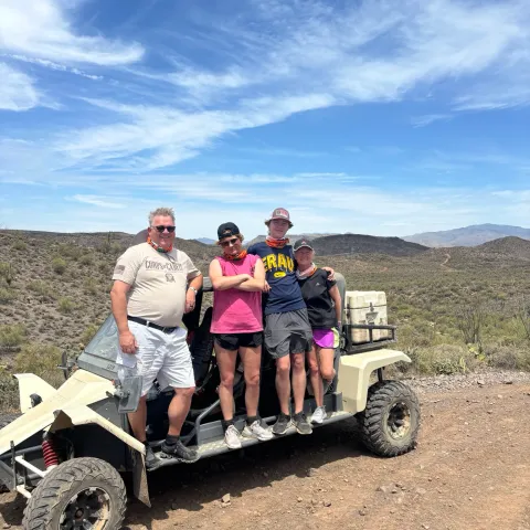 Family on a guided Scottsdale & Phoenix Tomcar ATV tour with Desert Wolf Tours in the Sonoran Desert — enjoying open-air off-road adventure with no helmets or goggles.