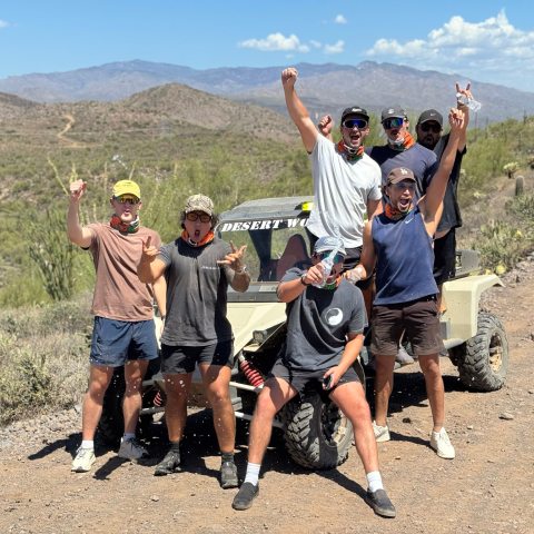 Guests enjoying a sunset Tomcar ride during a Scottsdale and Phoenix ATV tour with Desert Wolf Tours in the Sonoran Desert — no helmets or goggles.