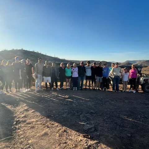 Couple driving a Tomcar during a Scottsdale and Phoenix off-road adventure with Desert Wolf Tours in the Sonoran Desert.